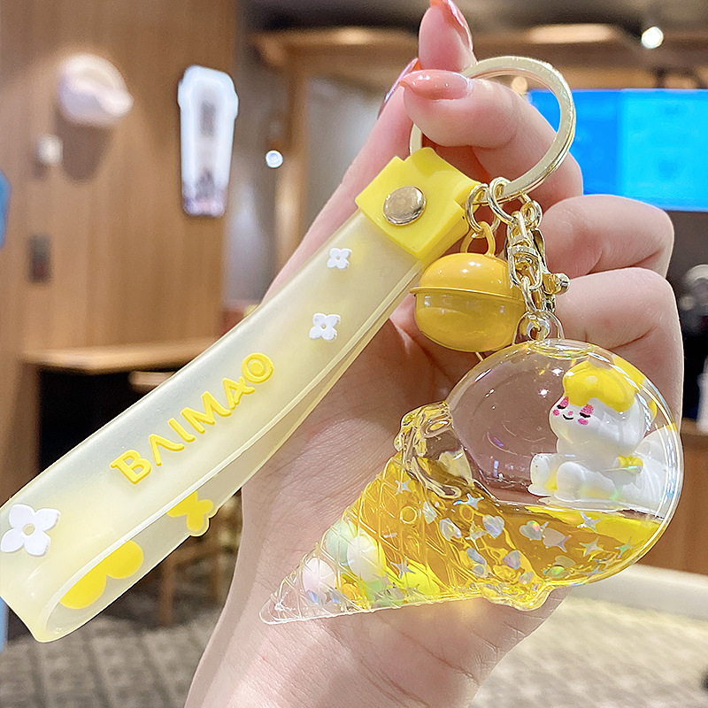 Llavero de unicornio transfronterizo para mujer, exquisito y lindo colgante de botella de arena líquida de cristal con forma de helado, accesorio para mochila, pequeño adorno.