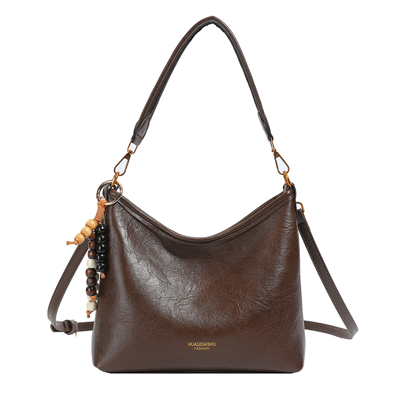 Nicho de alta sensación bolso de cuero suave para mujeres 2025 nueva moda versátil mochila de hombro mochila de viaje