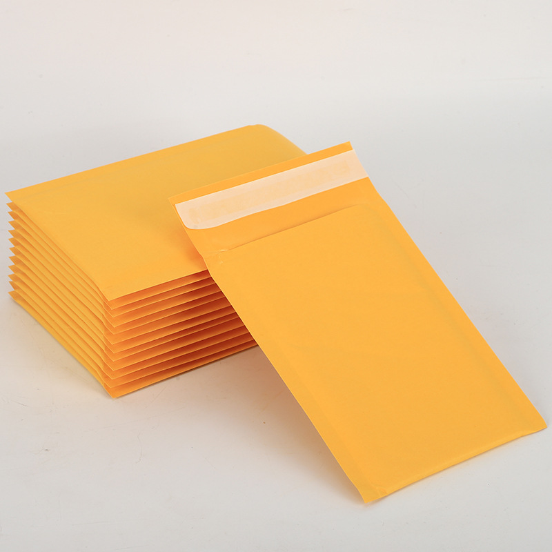 Bolso de sobre de burbuja de papel Kraft amarillo grueso bolso de espuma impermeable bolso de embalaje rápido bolso expreso bolso de burbuja al por mayor