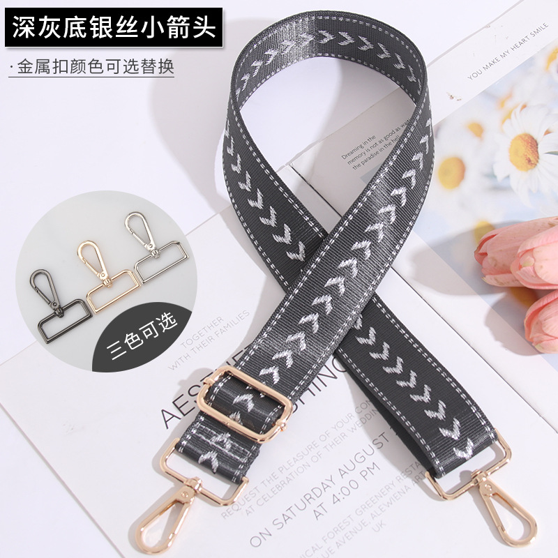 Small silver arrow on dark gray background