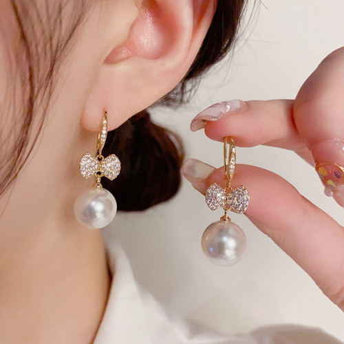 Japanese and Korean exquisite and fashionable ultra-glitter micro-paved zircon bow pearl ear hooks elegant and high-quality earrings wholesale