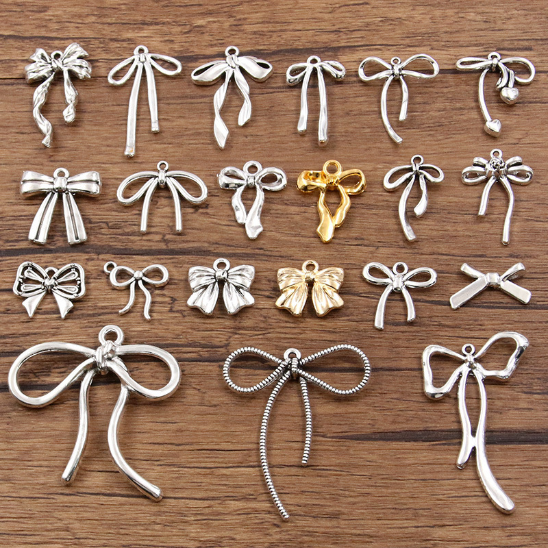 1 Piece of 25-Style DIY Alloy Jewelry Accessory, Hollow Cute Bow Pendant Charm, Necklace and Bracelet Accessory 1 Piece of 25-Style DIY Alloy Jewelry Accessory, Hollow Cute Bow Pendant Charm, Necklace and Bracelet Accessory