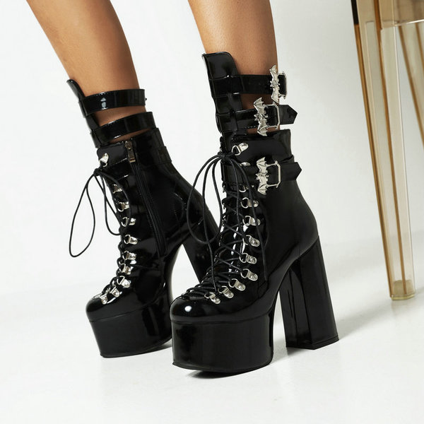 Black high boots with extremely high heels platform made of patent…