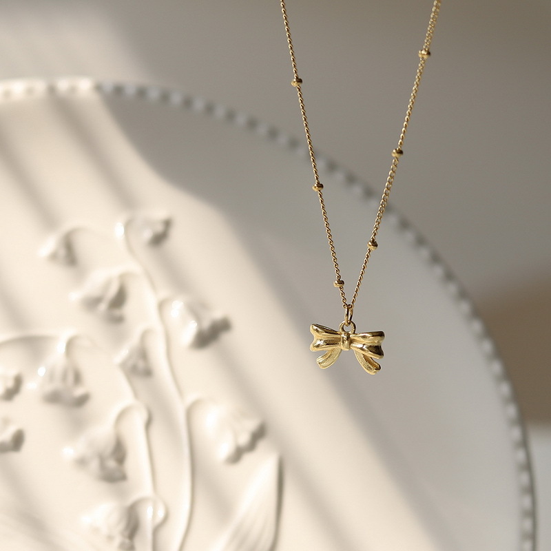 Women's Gender Titanium Steel Copper 18K Gold Plated Retro Bow Knot Pendant Necklace