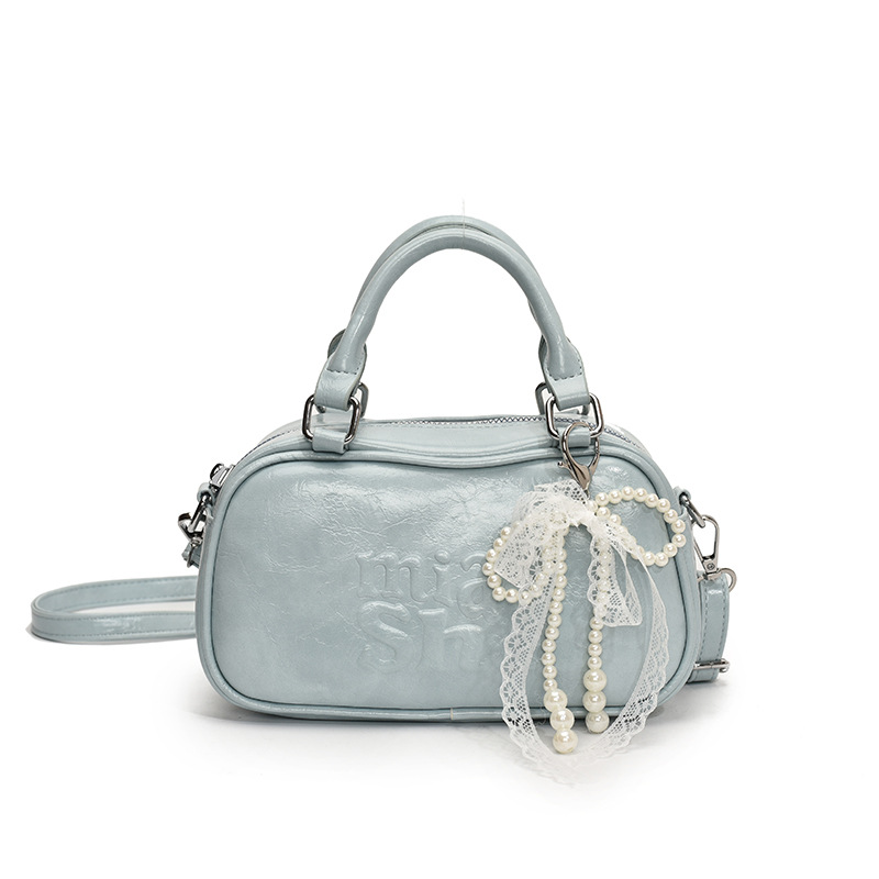 Versión coreana del bolso de bolos de mano para mujer 2025 nuevo bolso de hombro de moda de moda bolso de mensajero popular casual de todo fósforo