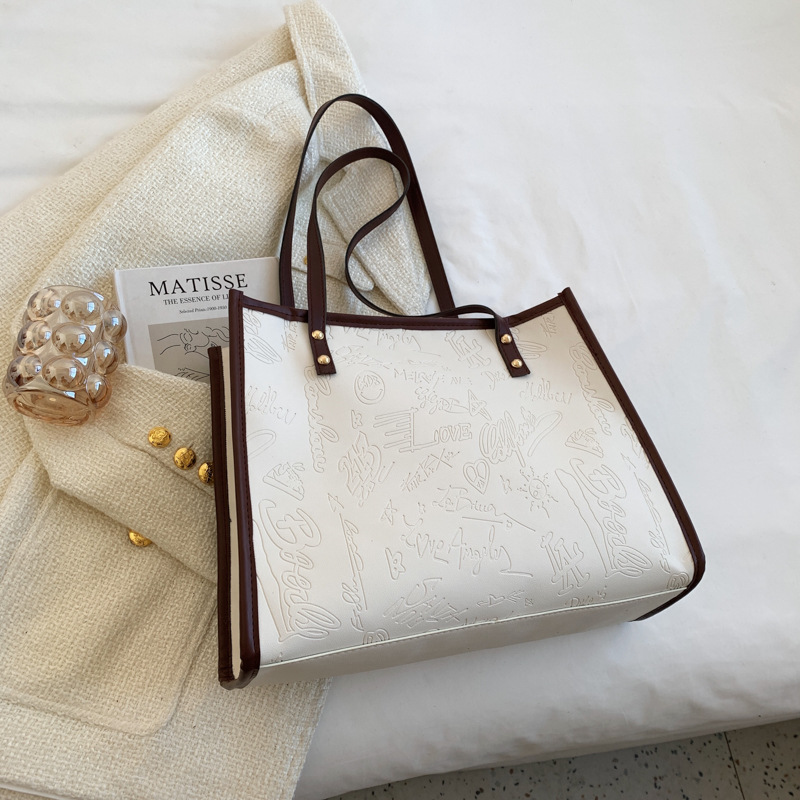 Bolso de mujer 2024 primavera nuevo nicho lienzo de cuatro hojas de gran capacidad bolso de hombro simple bolso de todo tipo