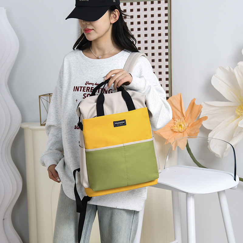 Bolso de mamá para madres y bebés de gran capacidad de estilo occidental, bolso de cercanías de almacenamiento de color en contraste de moda, mochila portátil multifuncional de un solo hombro
