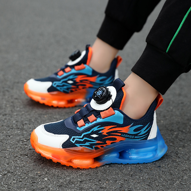 Zapatos primavera y otoño al por mayor medio y grandes zapatos para niños botón estudiante una pieza deportes malla de niño transpirable transporte giratorio