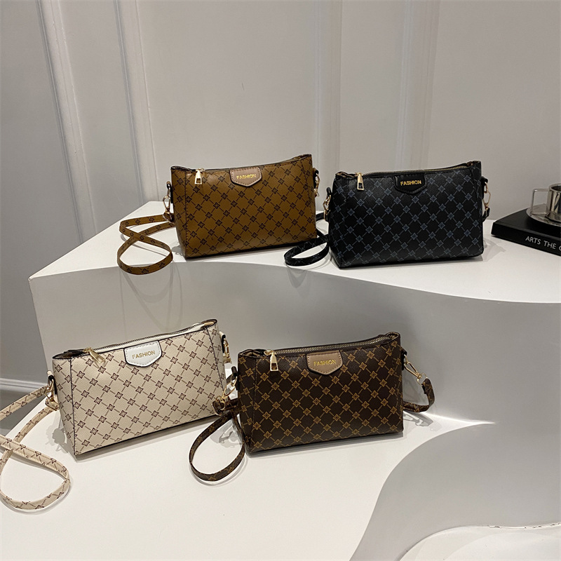Bolso de hombro para mujer a juego diario 2025 verano nuevo estilo PU moda europea y americana impresión retro letras bolso de mensajero