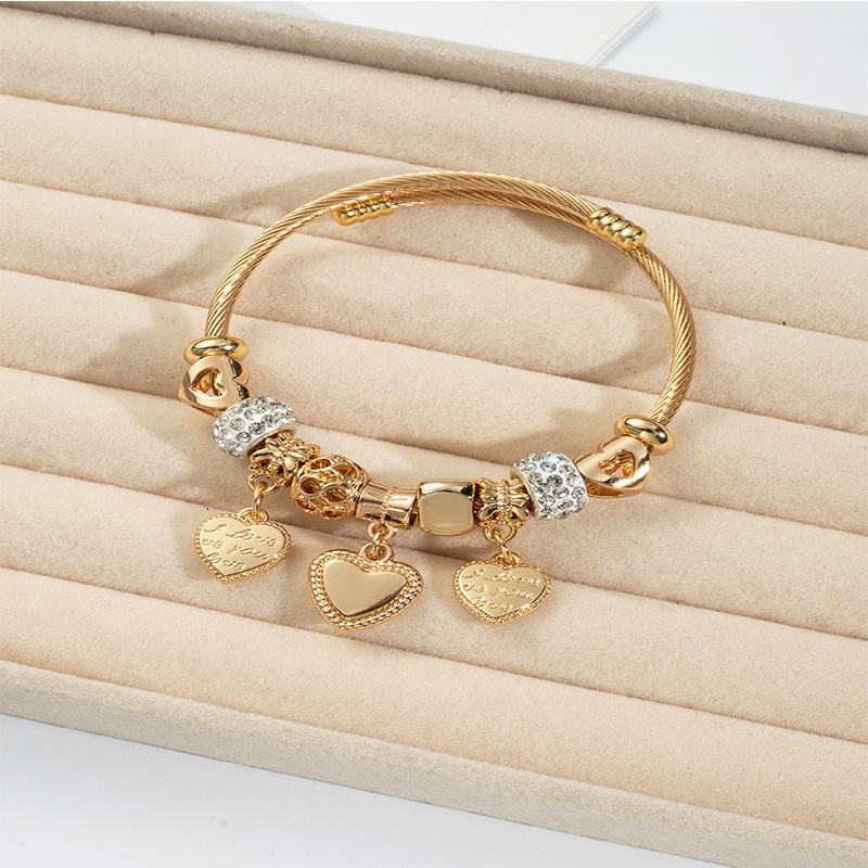 Panjia pulsera Dora DIY cuentas transfronterizas explosión de aleación en forma de corazón tallado colgante de letras de acero inoxidable brazalete de bola de perforación