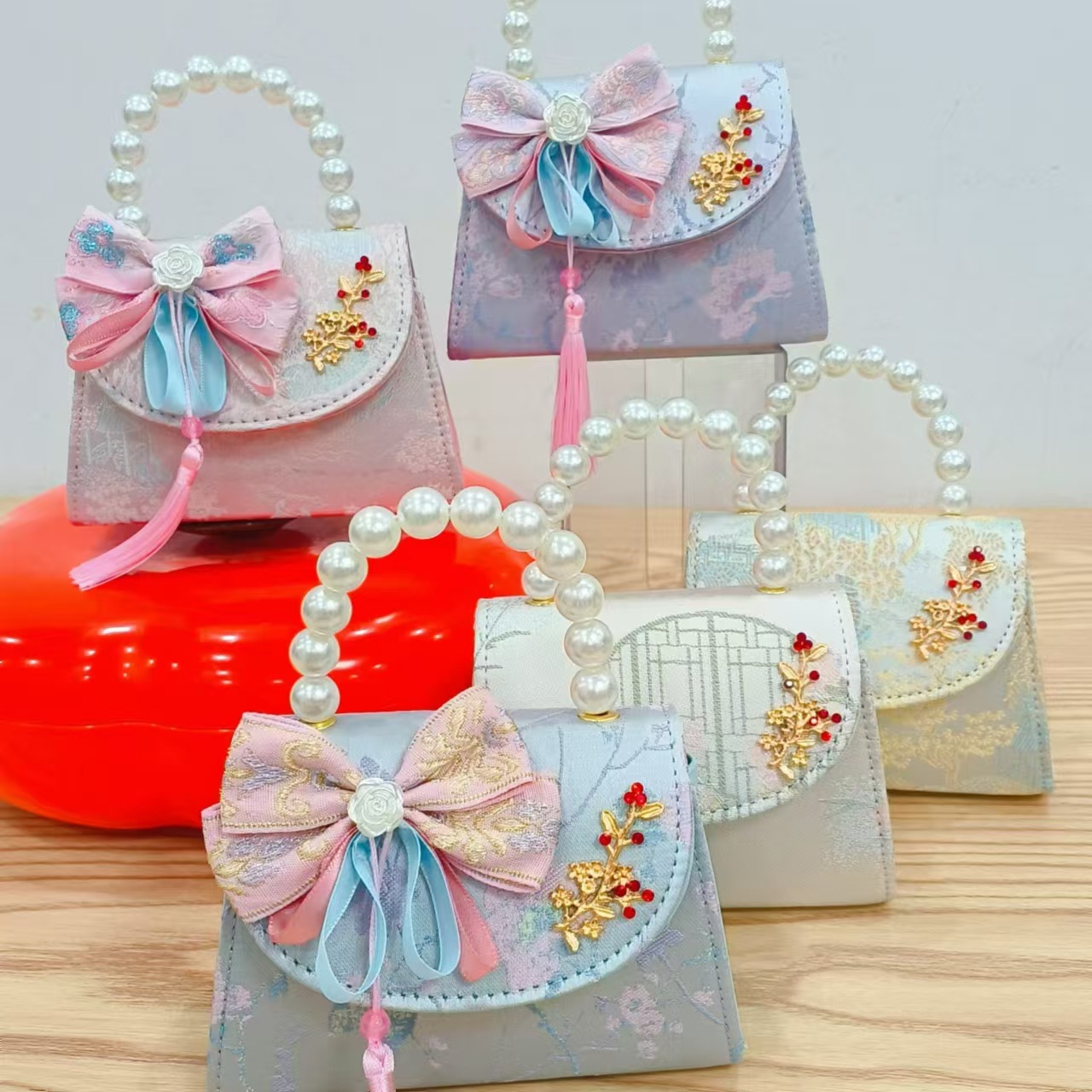 Niños pequeños bolsos de hombro de viento de fragancia de alta calidad exquisita niña antigua bolso de cambio princesa perla bolso de mano