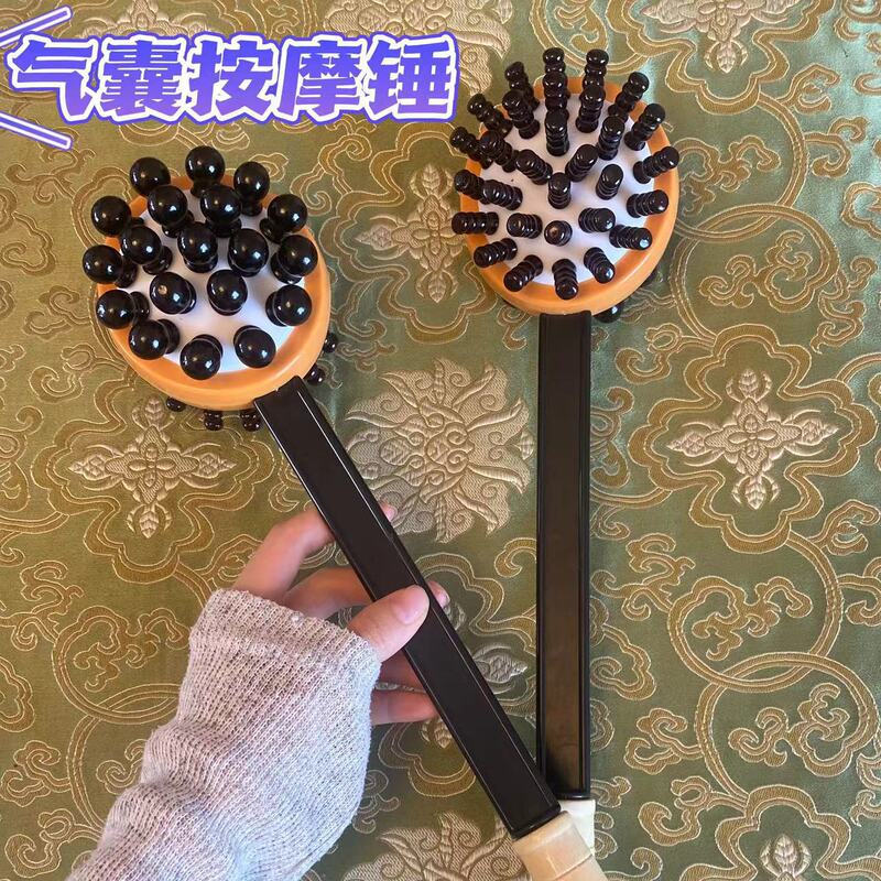 マッサージは木のシリコンをたたいて手のエアバッグをたたいてマッサージします。|undefined