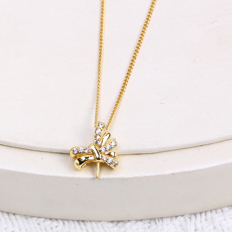 Ciondolo a fiocco con perla placcato oro per donna elegante_voghion.com