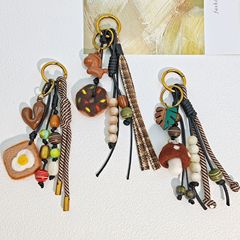 MIU シリーズクロスボーダーレトロエスニックスタイル手作りウールフェルトパンバッグ吊り編みビーズキーホルダー新しいペンダント