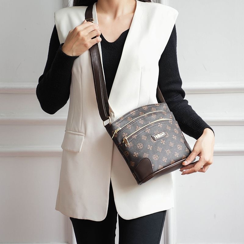 Guangzhou Hengli equipaje para mujer 2025 nuevo estilo coreano bolso de mensajero de un solo hombro bolso de cubo madre de mediana edad bolso de varias capas mujer