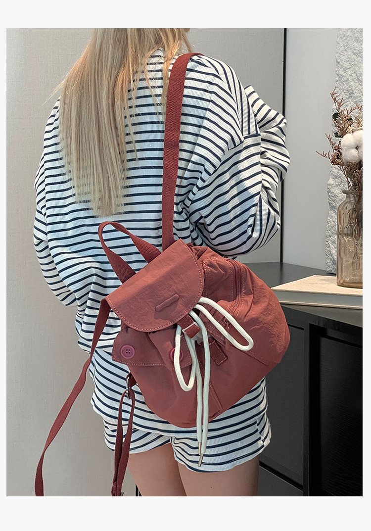 Colorful Fox's new Korean-style ins women's niche design lightweight pocket button drawstring backpack undefined