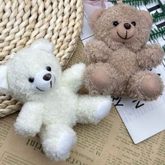 新型のかわいいぬいぐるみの座り方ミニベアテディベアのぬいぐるみのぬいぐるみがキーホルダーを飾っています。