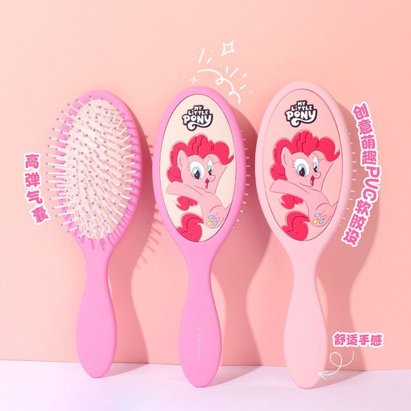 Ellipse massage comb