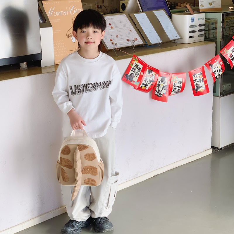 Mochila infantil transfronteriza de dibujos animados lindos dinosaurios cola mochila para niños y niñas jardín de infantes pequeña clase mochila para niños