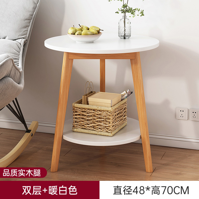Sofá de la sala de estar pequeña mesa redonda doméstica, estante de cabecera de cama moderno y minimalista, mesa de té creativa con balcón