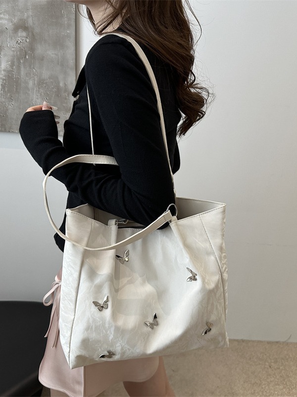 Bolsos de cubo de arco de alta calidad para mujeres 2024 verano nuevo estilo extranjero nicho bolso de hombro de moda bolso de mujer
