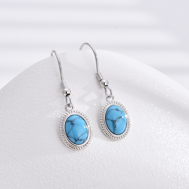 S925 plata esterlina turquesa pendientes nicho femenino retro Europa y América de moda ligera lujosa atmósfera alta sensación pendientes de orejas