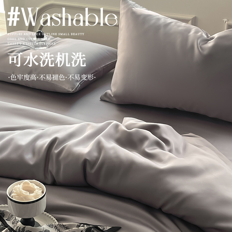 Juego de cama de verano de cuatro piezas de seda de hielo de lujo ligero 2025 nueva funda de edredón sábana sábana sábana ropa de cama desnuda sedosa
