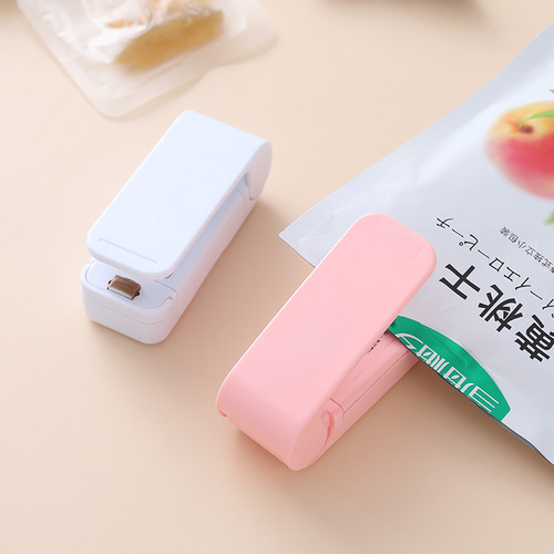 Portable mini sealing machine creative household food plastic bag opening sealing machine travel hand pressure heat sealing machine