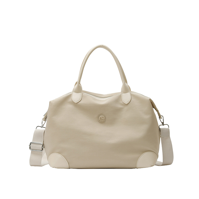 Nueva bolsa coreana para niños, bolsa de viaje ligera de gran capacidad, bolsa de mano casual simple de color sólido para niños y niñas