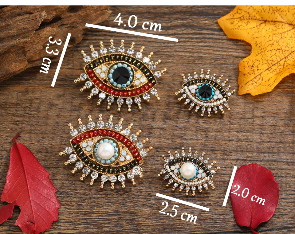 Retro Devil's Eye Alloy Inlay Rhinestones Pearl Unisex Brooches display picture 1