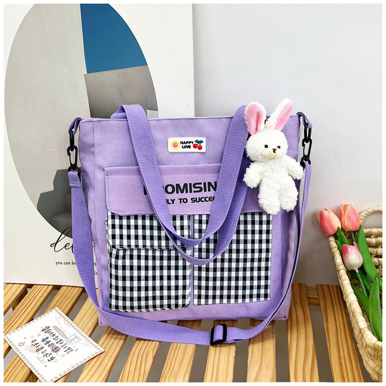 The new Korean-style cute nylon bag for class tutoring is a versatile checkered single-shoulder bag that is selling well (with a bear) undefined