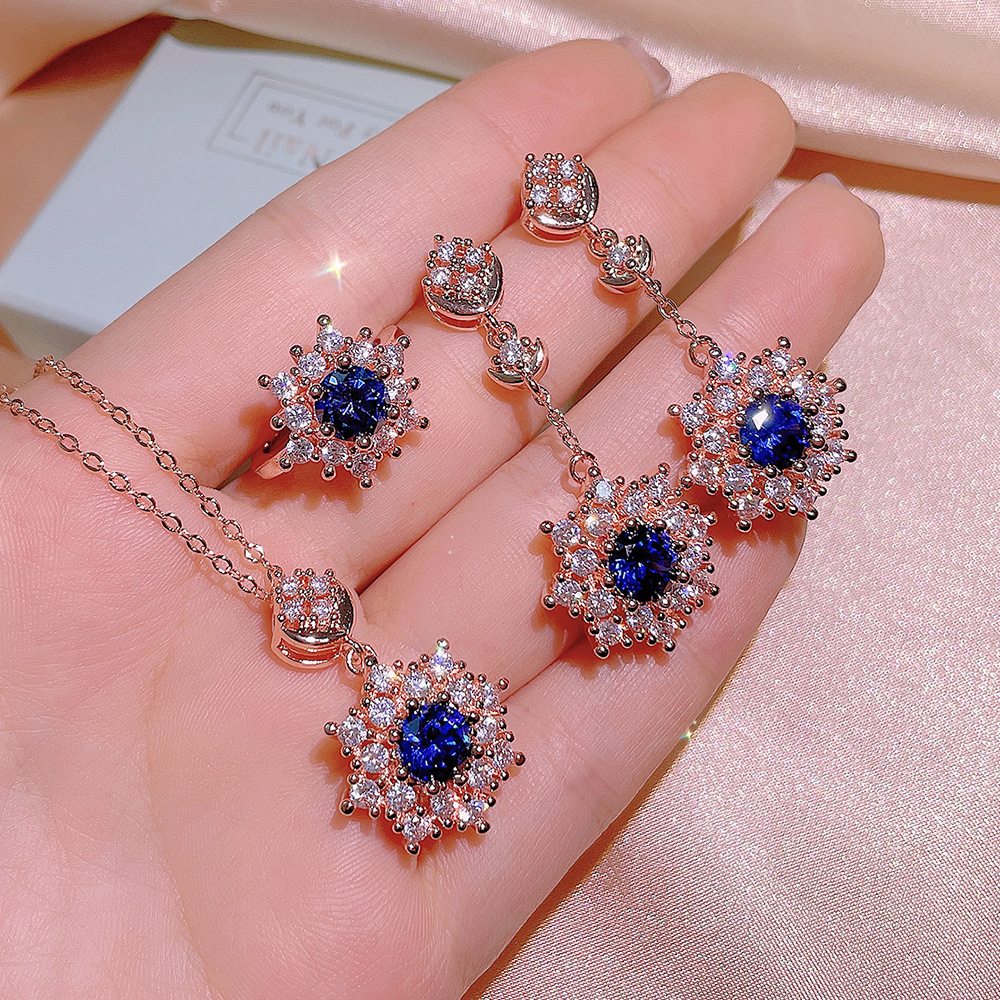 2021 nuevo conjunto de tres piezas de ZIRCON copo de nieve colgante collar pendientes anillo femenino ins traje de joyería de temperamento de moda