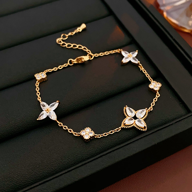 Brazalete de flores de oro real, pulsera de piedra de diamante, simple y de alto nivel, pulsera universal, nicho, lujo ligero, joyas de mano exquisitas para mujeres.