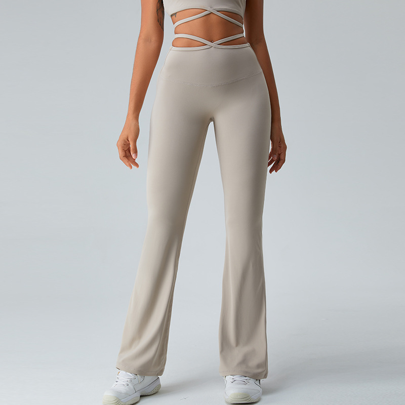 Cintura transfronteriza Correa delgada pantalones cruzados de yoga pantalones de pierna ancha de cintura alta desnuda de mujer corriendo deportes fitness ropa de yoga