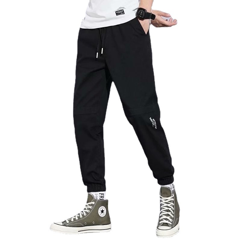 Pantalones de estilo de Hong Kong pantalones casuales de los hombres de estilo japonés de color sólido sueltos monos atados a los tobillos pantalones casuales de los hombres de la marca de moda Pantalones a juego