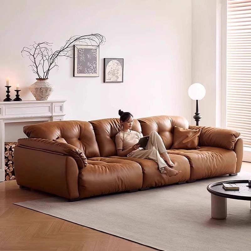 Italian-style vintage cloud sofa, genuine leather, suitable for small living rooms, retro design, simple style, with a movable backrest