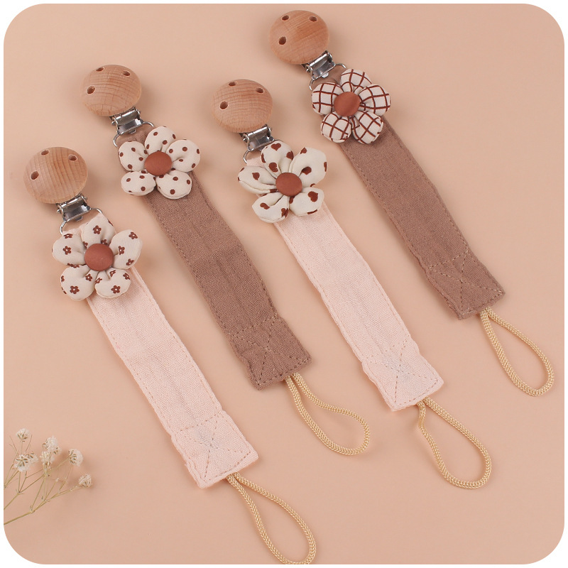 Nuevos suministros de bebé clip de chupete de haya calmante bebé DIY Flor de dibujos animados tira de lino de algodón cadena anti-caída