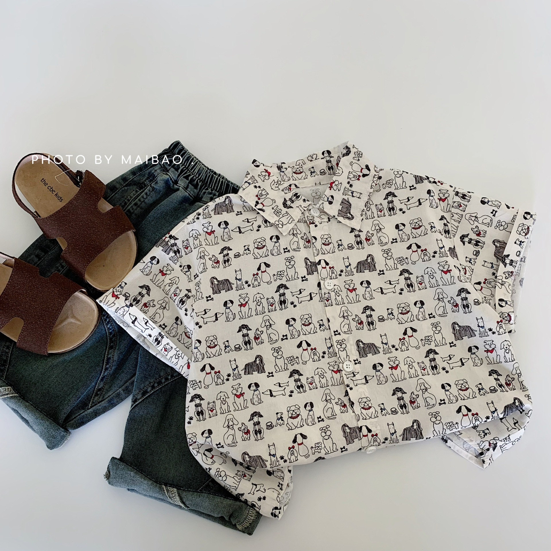 Camisa de manga corta para niños Maibao 2025 verano nuevo estilo coreano niño camisa de cachorro de impresión completa niño verano al por mayor