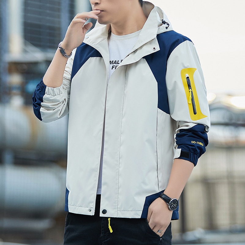 Nueva primavera y otoño chaqueta al aire libre pareja chaqueta a prueba de viento impermeable chaqueta con capucha Top montañismo ropa hombres al por mayor