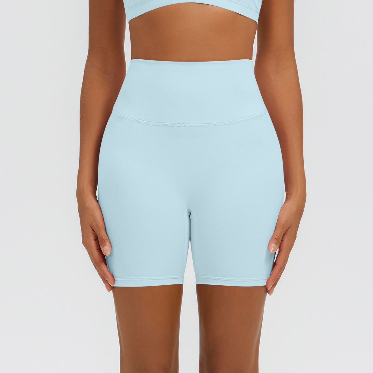 Nuevo tipo delgado de hielo, piel transpirable, ajustado, color sólido, ropa de yoga, pantalones cortos de tres puntos.
