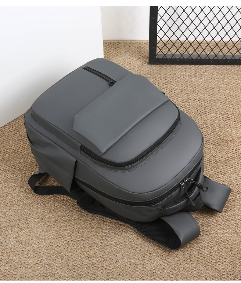 Wholesale of in-stock commuting and business backpacks for men, simple and large-capacity USB charging laptop bags, and student schoolbags undefined