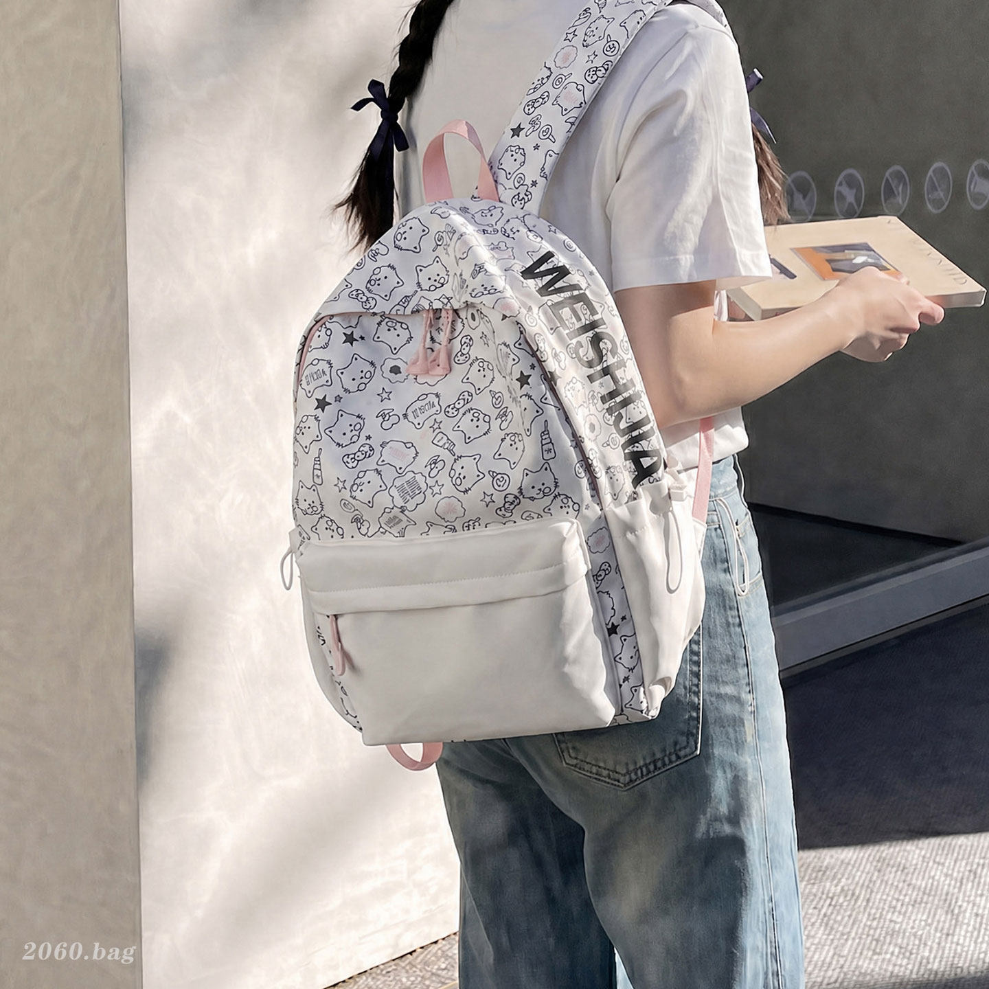 Bolsa de escuela secundaria de dibujos animados universales 2026 viaje ocio nueva mochila de gran capacidad impresión popular