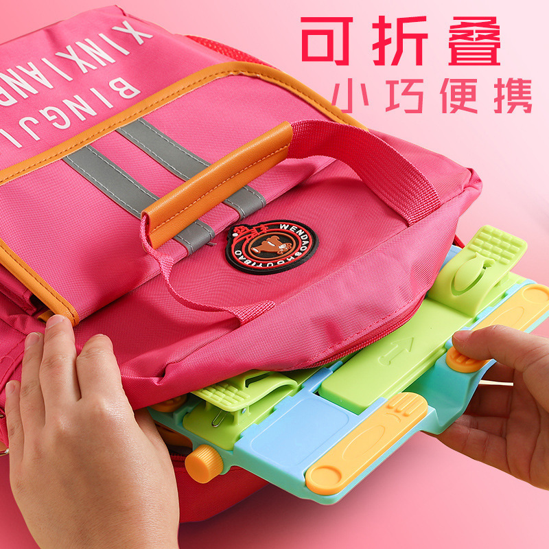 子供の読書棚の小学生は読書スタンドで本棚の携帯多機能デスクトップを読むことができます。|undefined