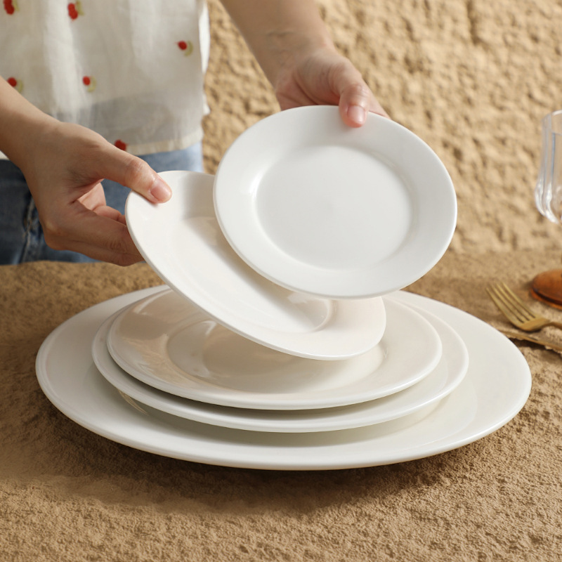 Restaurante de platos de comida occidental redonda de cerámica blanca pura Phnom Penh plato de filete de alta gama plato plano escupir hueso plato plato plato plato plato plato