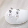 White mosquito coil pearl with zircon, ear clips