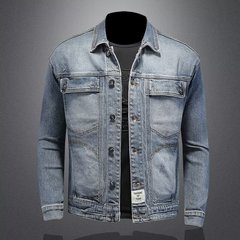 デニムのコートの男性と春秋の新型の高弾力の修身は襟を返します。