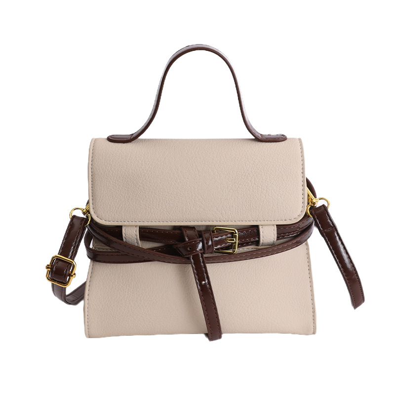 Bolsas de mano de nicho coreano de color contraste para mujeres 2026 primavera textura simple moda diaria correa de hombro mochila