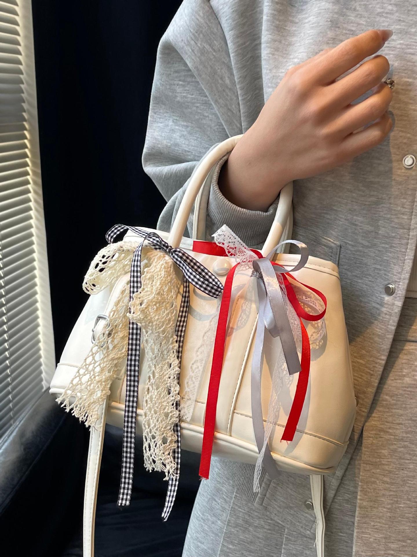 Bolsos de jardín portátiles populares de este año para mujer 2025 nuevos productos bolsos de hombro coreanos de nicho bolsos de cubo de todo fósforo de alta gama