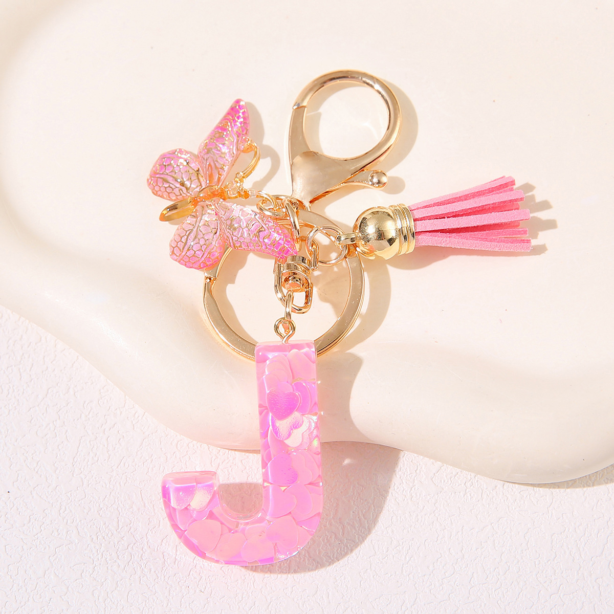 Nuevo rosa damas letras A-Z llavero de goteo de goma sequilla amor letras bordas mariposa llavero transfronterizo