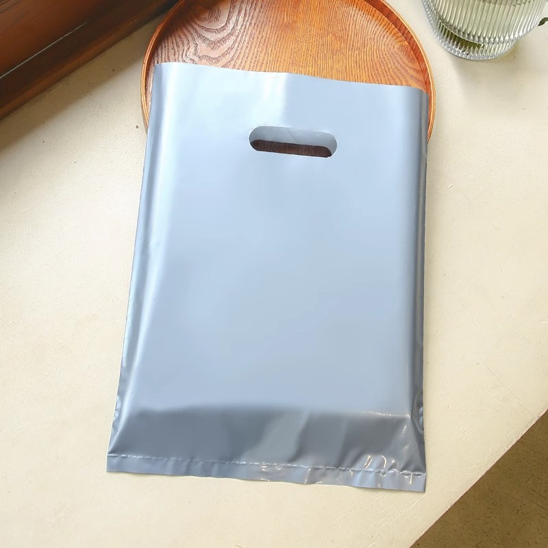 Bolsa de mano de tienda de ropa de grosor, bolsa de embalaje de ropa para niños y niñas, bolsa de almacenamiento de cosméticos, bolsa de regalo, bolsa de embalaje comercial